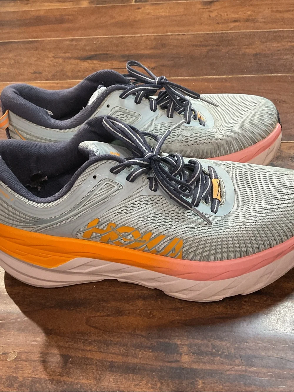 Hoka Blue Athletic Shoes with Orange and Pink Accents